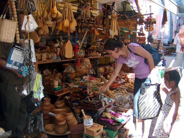 Nursel and Beyza are checking wooden gifts at the front of Vatandash gift shop (26-7-2005)